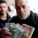 العراق: انخفاض قيمة الدينار العراقي في مقابل الدولار الأميركي